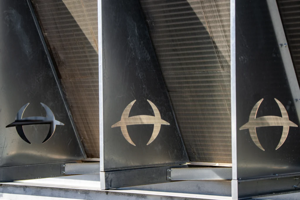 Hayden logo stamped out of metal on a piece of heat exchange equipment